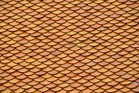 屋顶彩绘摄影照片_金棕色釉面亚洲古董屋顶瓦片