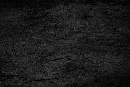 深色木桌面摄影照片_木深色背景纹理。