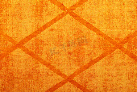 带有菱形图案的橙色纺织品表面的纹理和背景。