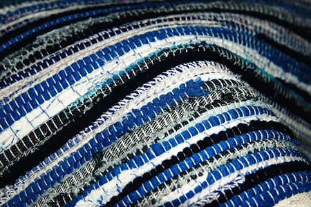 编织蓝摄影照片_细节蓝白编织地毯