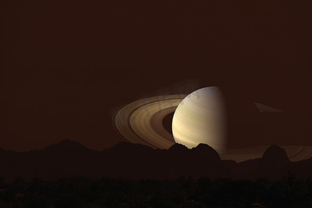 行星剪影摄影照片_在云彩和夜空的土星背面剪影山