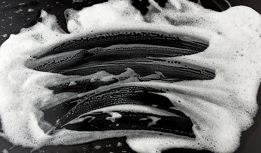 黑色背景上的白色肥皂泡沫，顶视图，clea 的概念
