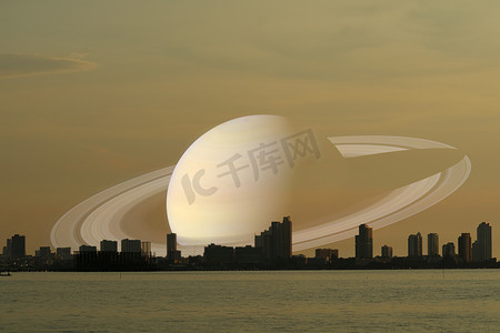 日落影摄影照片_土星在夜空背侧影城市日落