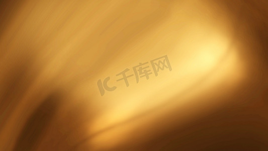 波浪曲线金色摄影照片_抽象的金色液体光滑背景与波浪奢华。 