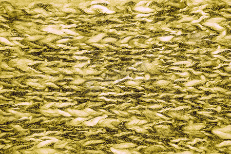 黄色混纺蓬松编织线毛衣或围巾作为背景