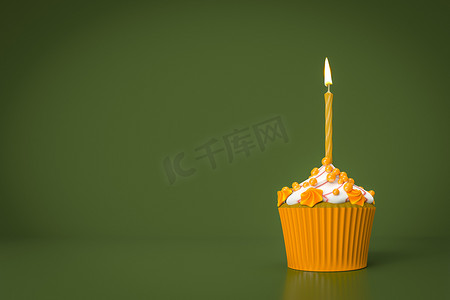 带蜡烛蛋糕摄影照片_带蜡烛的橙色蛋糕