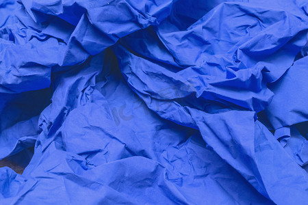 旧皱纸蓝色特写背景的碎片