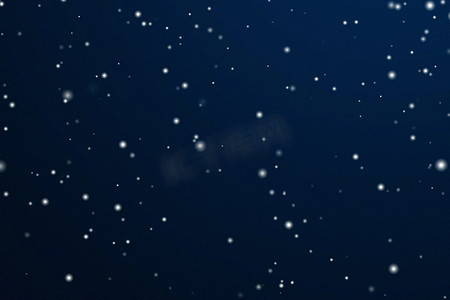 深蓝色蓝色摄影照片_冬季假期和冬季背景，白雪落在深蓝色背景上，雪花散景和降雪颗粒作为圣诞节和下雪假期设计的抽象雪景