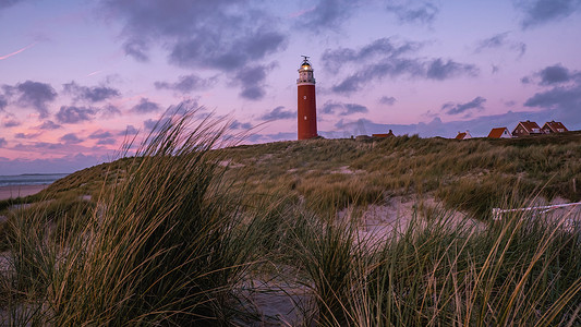 德克尔摄影照片_在日落期间的特塞尔灯塔荷兰荷兰岛特塞尔荷兰