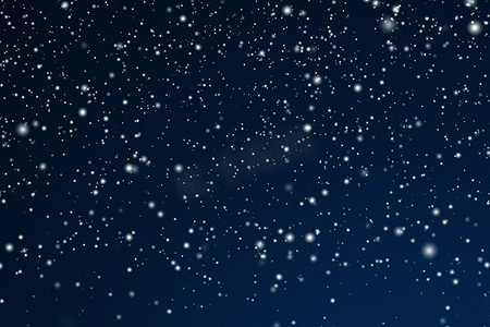 冬季假期和冬季背景，白雪落在深蓝色背景上，雪花散景和降雪颗粒作为圣诞节和下雪假期设计的抽象雪景