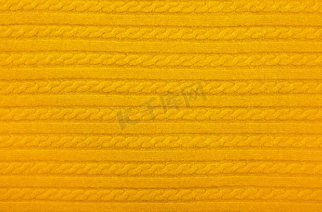 黄色针织羊毛织物的背景纹理