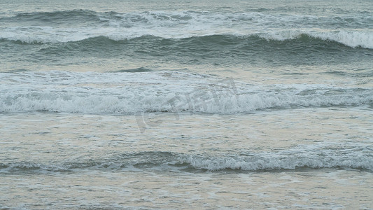 蓝色海浪纹理摄影照片_海浪在日落纹理