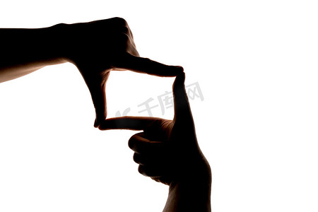 拍照相框摄影照片_显示在白色上隔离的相框手势的手部轮廓