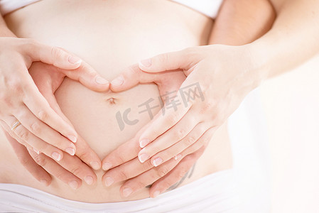 怀孕了摄影照片_夫妇怀孕了。