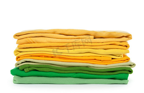 折叠衣服摄影照片_绿色和黄色折叠的衣服