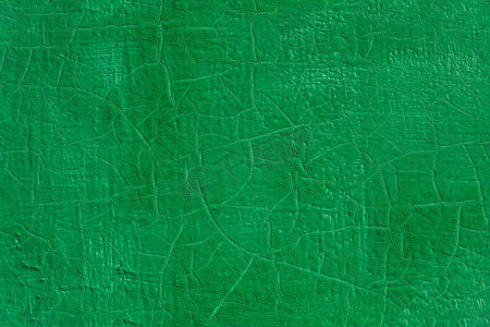 扁平钢表面厚绿色新鲜油漆无缝纹理下有旧裂缝