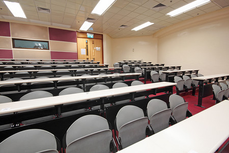 教室走廊摄影照片_空荡荡的大厅，配有灰色扶手椅