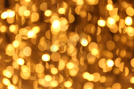 散景背景金黄色五颜六色的圣诞快乐，新年快乐散景灯光照耀在夜间背景，散景闪光灯，金色豪华背景纹理，闪闪发光的壁纸