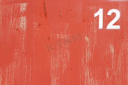 风化摄影照片_风化的红漆墙纹理。