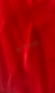 红色质感纹理背景摄影照片_红色抽象艺术背景、丝绸质感和运动波浪线，适合经典奢华设计