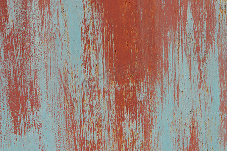 红漆墙壁纹理上的风化蓝锈。
