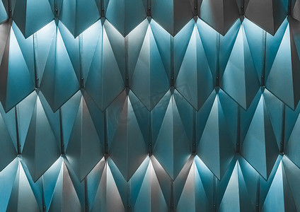 对称建筑摄影照片_具有金属图案、对称建筑背景的蓝色几何抽象纹理