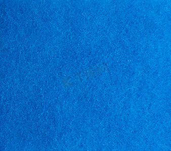 回弹海绵摄影照片_带纤维的厨房海绵的蓝色纹理，全框