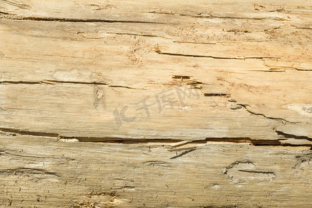 木材开裂摄影照片_具有自然图案的旧木材纹理，颜色开裂，背景