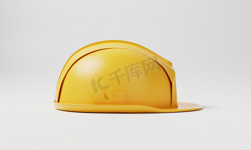 黄色安全帽摄影照片_白色背景上的黄色安全帽安全帽。