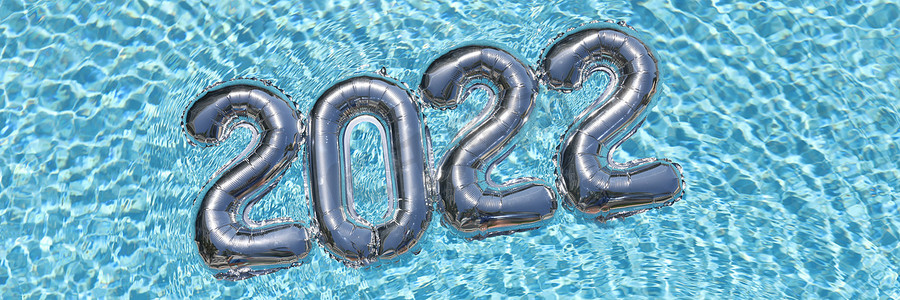 气球编号摄影照片_游泳池顶视图特写背景中躺在水面上的编号为 2022 的氦气球