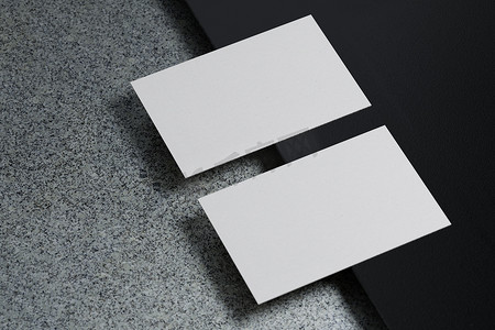 白色水平名片纸样机模板，带有空白封面，用于在黑色纸板地板背景上插入公司徽标或个人身份。