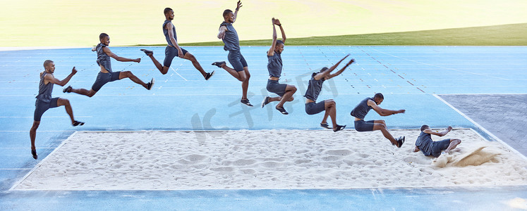 沙坑摄影照片_一名健康的男运动员在沙坑中跳跃参加跳远比赛的镜头。