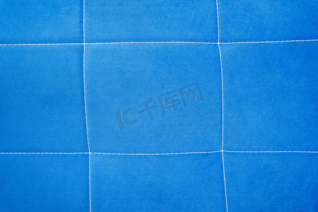 blue fabric backgroundbackground of blue fabric with stitching 蓝色织物背景