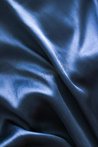 豪华深蓝色软丝平底背景纹理，假日魅力抽象背景