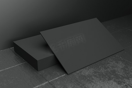 个人名片设计摄影照片_黑色水平名片纸样机模板，带有空白空间盖，用于在黑色混凝土地板背景上插入公司徽标或个人身份。