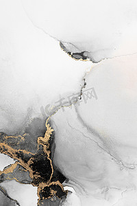 黑金设计摄影照片_纸上大理石液体水墨艺术画的黑金抽象背景。