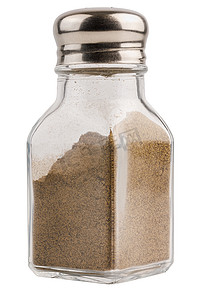 透明罐摄影照片_玻璃胡椒罐与白色背景中分离的黑胡椒粉
