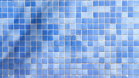浮雕收官之战摄影照片_蓝色瓷砖平方，马赛克背景