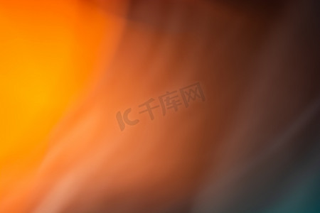 灯海报摄影照片_黑暗中橙色光的抽象。
