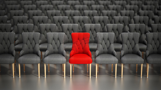 红色椅子在一排灰色布艺椅子中脱颖而出。 