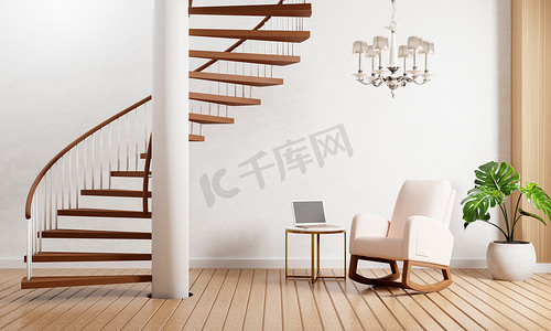 有楼梯的现代客厅在有白色墙壁背景的木地板上种植枝形吊灯和膝上型计算机。