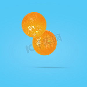 创意彩色背景上的橘子水果，以剪切路径作为包装设计元素