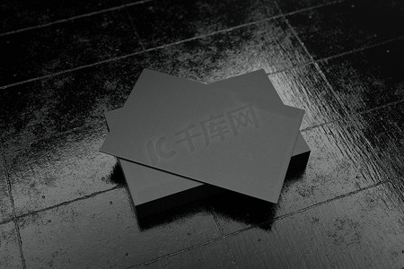 黑色水平名片纸样机模板与空白空间封面，用于在黑色纸板地板背景上插入公司徽标或个人身份。