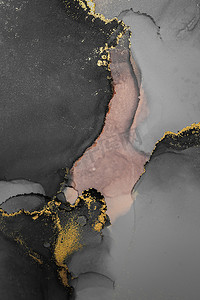 艺术水彩水墨摄影照片_大理石液体水墨艺术画在纸上的深金色抽象背景。