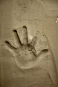 检验证据摄影照片_水泥砂浆墙上的手印