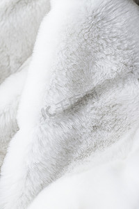 欧美秋装摄影照片_豪华白色皮大衣纹理背景，人造织物细节