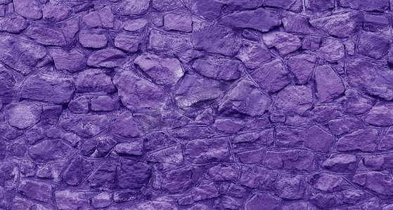 用紫色油漆绘的石头抽象背景。