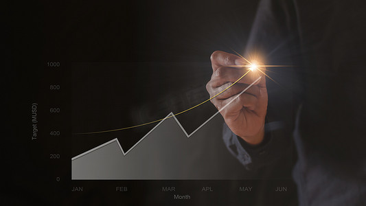 股票会议摄影照片_商人手绘图图表股票的增长。
