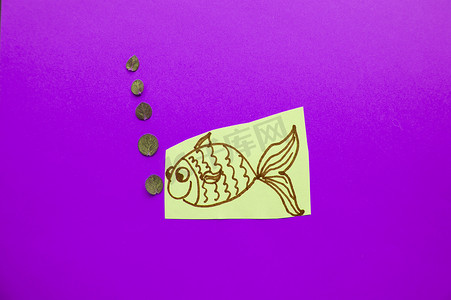 愚人节活动背景摄影照片_紫色背景上有气泡的有趣鱼，愚人节