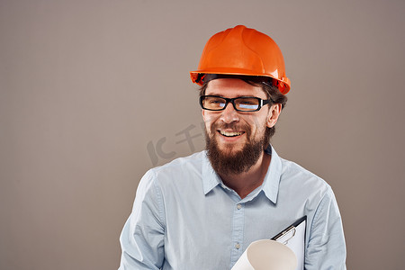 快乐的人橙色安全帽文件专业图纸建筑